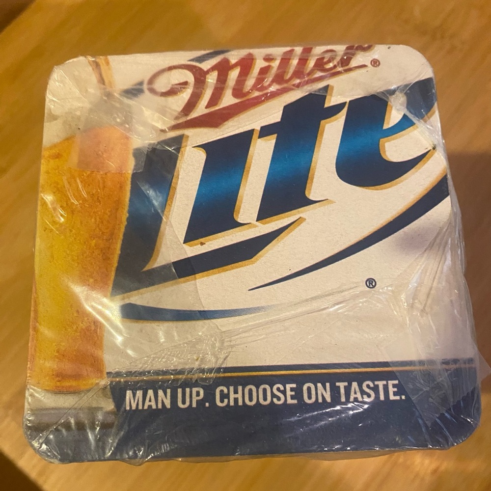 MILLER LITE New unopened sleeve of 125 “Man Up” collectible beer coasters 2011